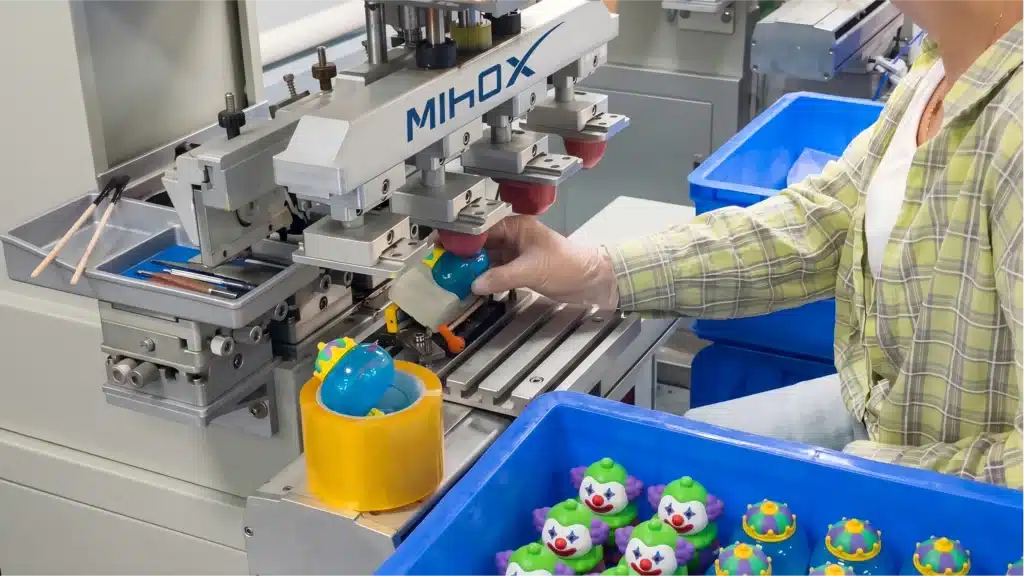 High-precision pad printing machine at MIHOX factory providing consistent detailing for custom figure mass production