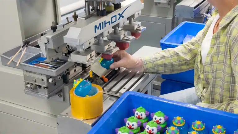 High-precision pad printing machine at MIHOX factory providing consistent detailing for custom figure mass production