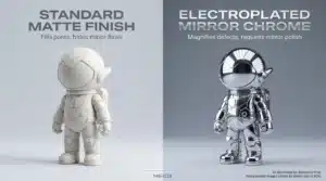 Side-by-side comparison of standard matte finish and electroplated mirror chrome on an astronaut art toy, demonstrating the surface quality difference in manufacturing.