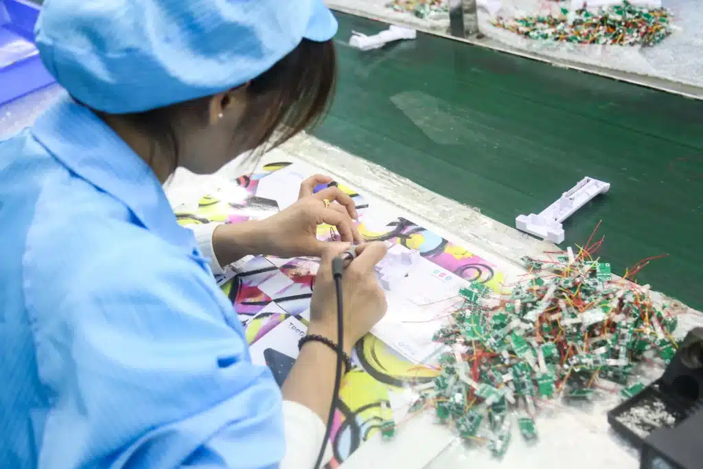 Electronic component assembly for custom injection molded toys